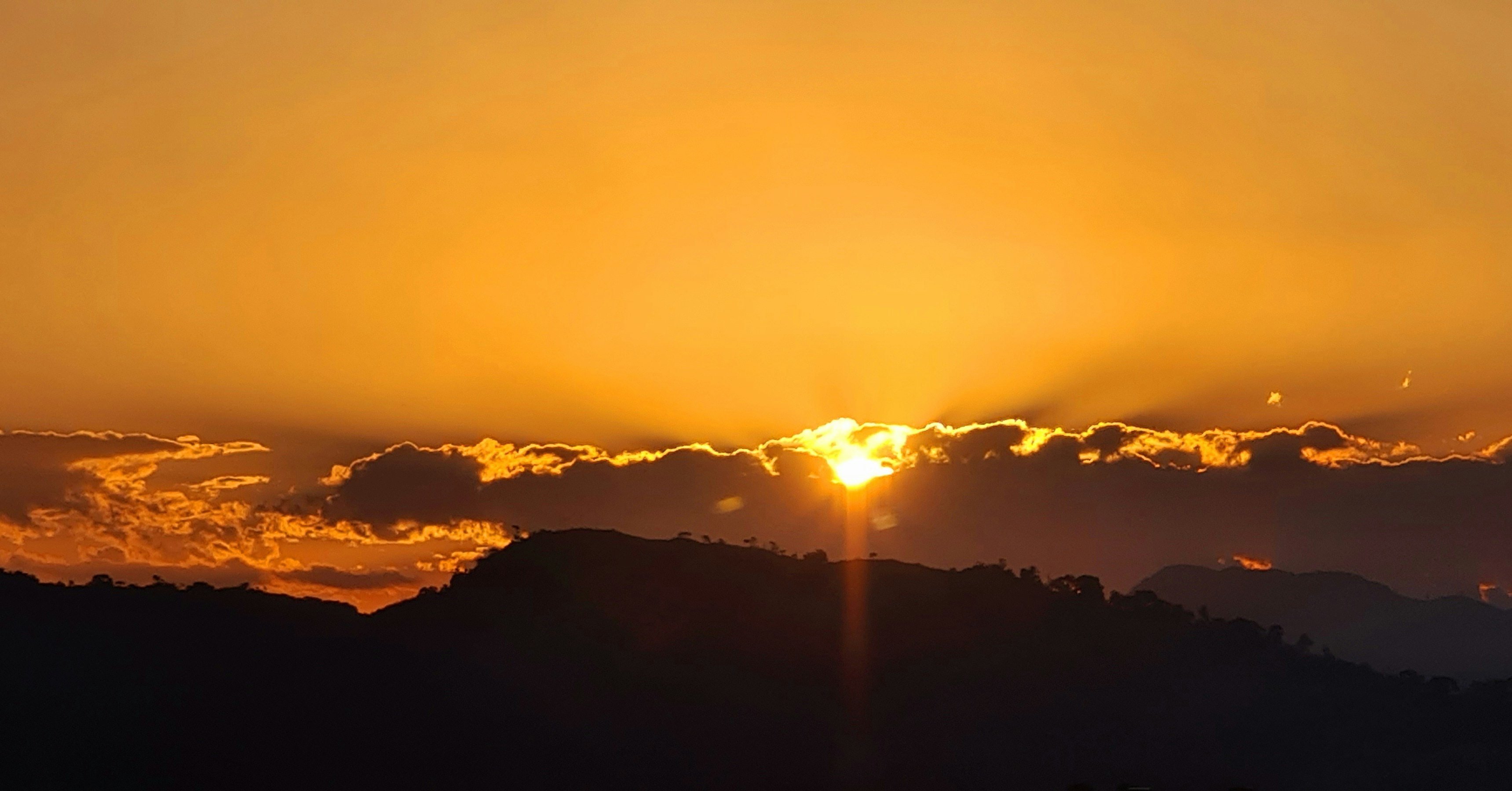 silhouette of mountains during sunset